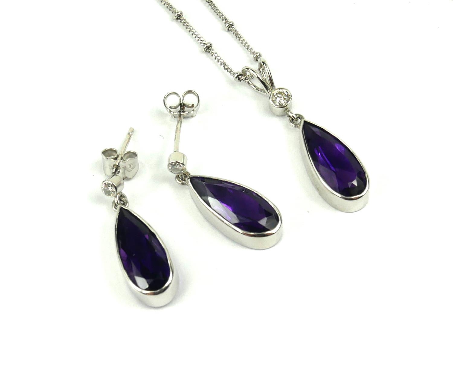 A VINTAGE 18CT WHITE GOLD, AMETHYST AND DIAMOND PENDANT NECKLACE AND EARRINGS SUITE Having a pear - Image 2 of 2