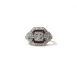 AN ART DECO STYLE 18CT WHITE GOLD, RUBY AND DIAMOND CLUSTER RING Having four central diamonds and
