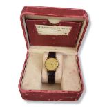 OMEGA, DE VILLE, A VINTAGE 18CT GOLD GENTâ€™S WRISTWATCH Ultra thin case with gold tone dial and