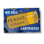â€˜WE SELL PURDY, LONDON, CARTRIDGES, A BLUE CAST IRON AND ENAMEL RECTANGULAR ADVERTISING SIGN (