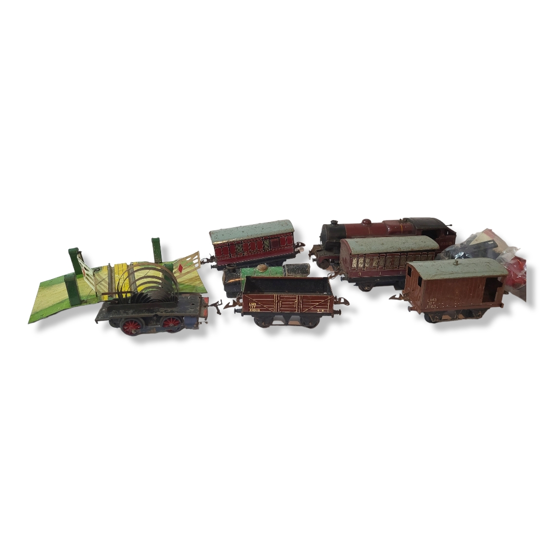 HORNBY, AN EARLY 20TH CENTURY DIECAST CLOCKWORK MODEL TRAIN Having maroon livery marked â€˜LMS