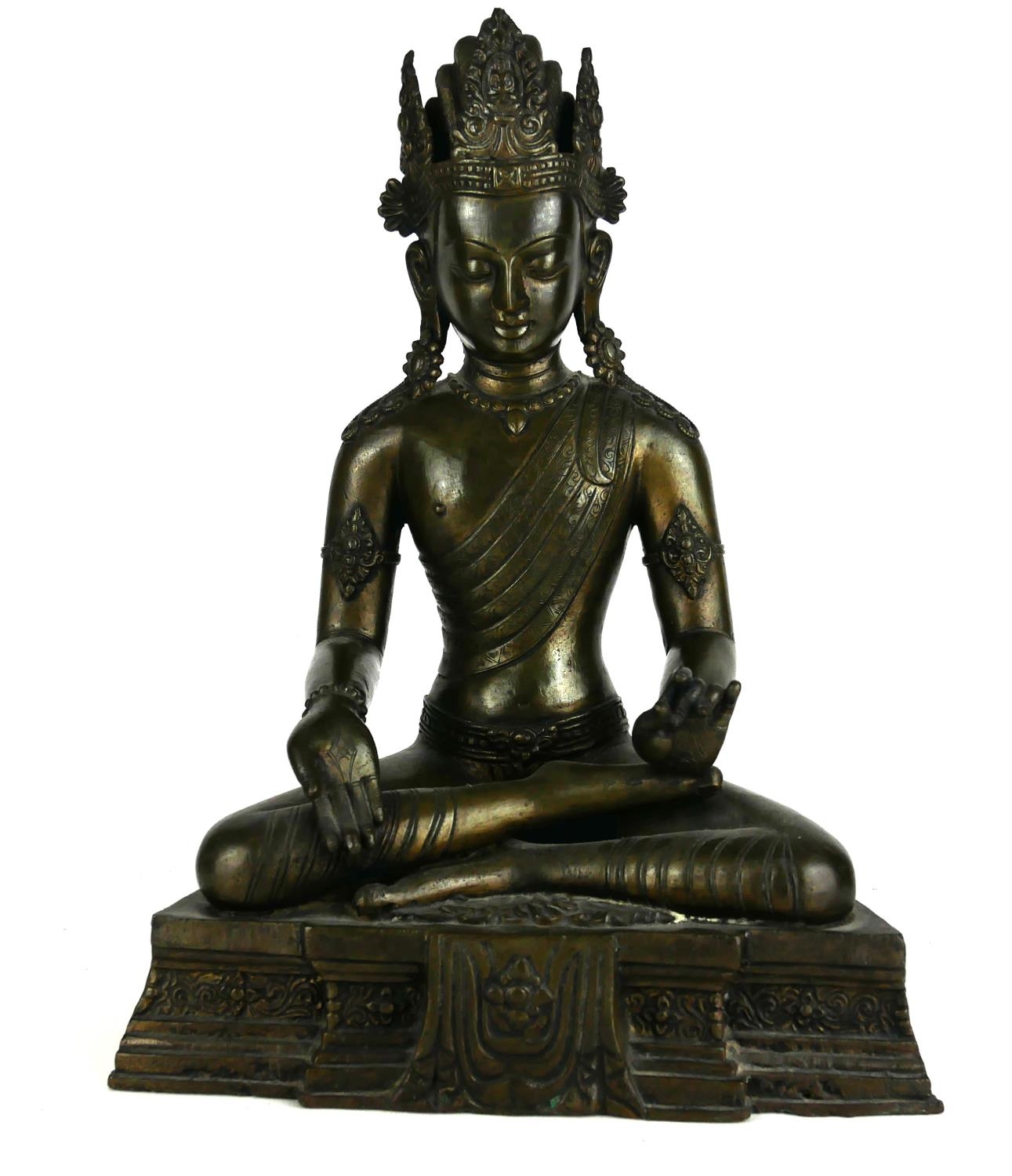 A CHINESE BRONZE FIGURE OF BUDDHA SAKYAMUNI In a seated pose with one hand open and one closed. (