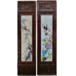 A PAIR OF 20TH CENTURY CHINESE HARDWOOD MOUNTED PORCELAIN PLAQUES Depicting a group of Oriental