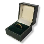 A VINTAGE 18CT GOLD WEDDING RING In a velvet lined box. (size P) Condition: good
