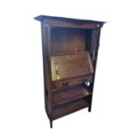 IN THE MANNER OF LIBERTY & CO., AN ARTS & CRAFTS PERIOD AND DESIGN OAK BUREAU/BOOKCASE. (95cm x 36cm