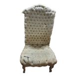 A 19TH CENTURY FRENCH CHILDâ€™S CORRECTIONAL CHAIR In button back calico upholstery, on painted