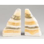 A PAIR OF MEXICAN ONYX BOOKENDS Each (h 17cm x w 12cm x d 4cm)