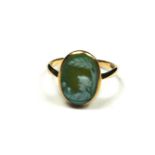 AN EARLY 20TH CENTURY 9CT GOLD CAMEO RING The oval porcelain cameo with female classical