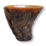 A 20TH CENTURY CHINESE HORN LIBATION CUP Archaic form, decorated with two provincial figures amongst