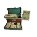 AN EARLY 20TH CENTURY CHINESE BONE AND BAMBOO MAHJONG SET Having four trays of counters, complete