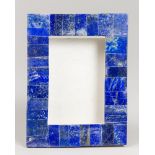 A LAPIS LAZULI PICTURE FRAME ON WHITE MARBLE (h 21cm x w 16cm x d 5.5cm)