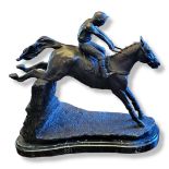 AFTER WILLIS GOOD, A 20TH CENTURY CAST BRONZE OF A MOUNTED JOCKEY Raised on a rustic marble base. (