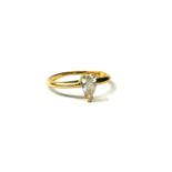 AN 18CT GOLD AND PEAR CUT DIAMOND SOLITAIRE RING. (UK ring size MÂ½, gross weight 1.7g, approx