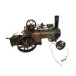 AN EARLY 20TH CENTURY SCRATCH BUILT STEEL AND BRASS LIVE STEAM TRACTOR ENGINE. (length 50cm x w 21cm