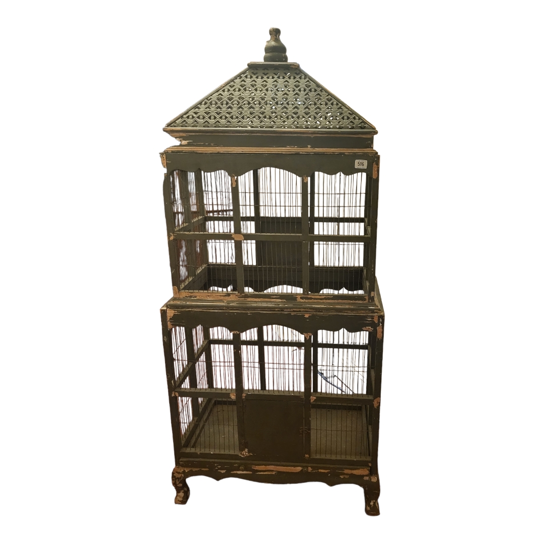 A LARGE EARLY 20TH PAINTED PINE FLOOR-STANDING BIRD CAGE With pierced metal top above two