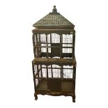 A LARGE EARLY 20TH PAINTED PINE FLOOR-STANDING BIRD CAGE With pierced metal top above two