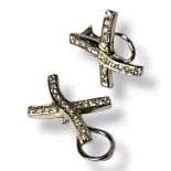 A PAIR OF WHITE METAL AND DIAMOND 'KISS' EARRINGS Set with a row of round cut diamonds and stud