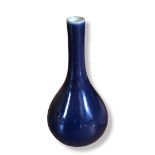 A CHINESE BLUE GLAZE PORCEKAIN BUD VASE Plain form, bearing underglaze blue square character mark to