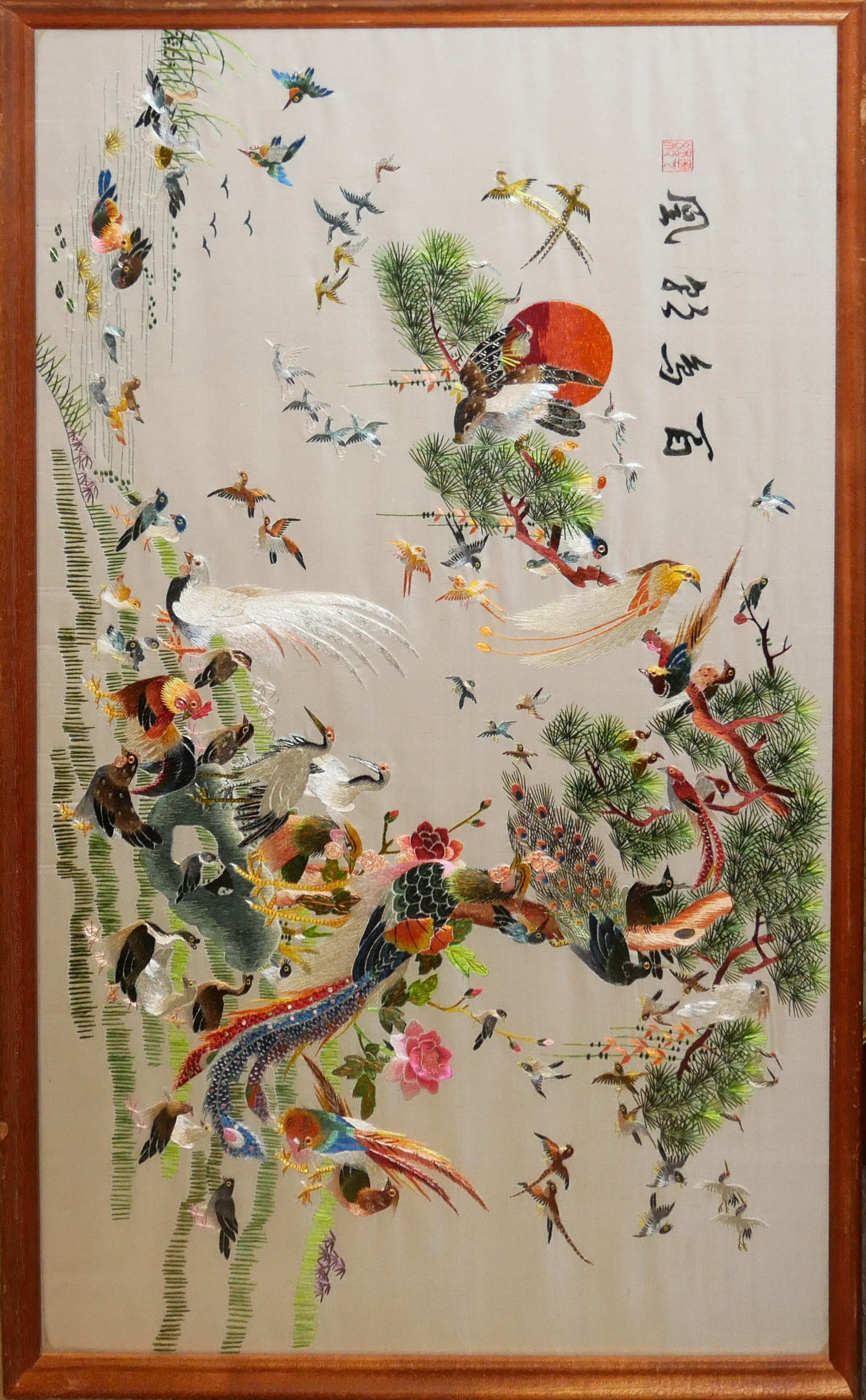 A CHINESE EMBROIDERED SILK PANEL Exotic birds, framed and glazed. (46cm x 76cm) Condition: good