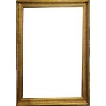 A SET OF FOUR EARLY 20TH CENTURY CARVED GILT RECTANGULAR PICTURE FRAMES With scrolled decoration,