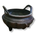 AN ASIAN BRONZE CENSER With white metal inlaid decoration on ribbed body, bearing seal mark. (