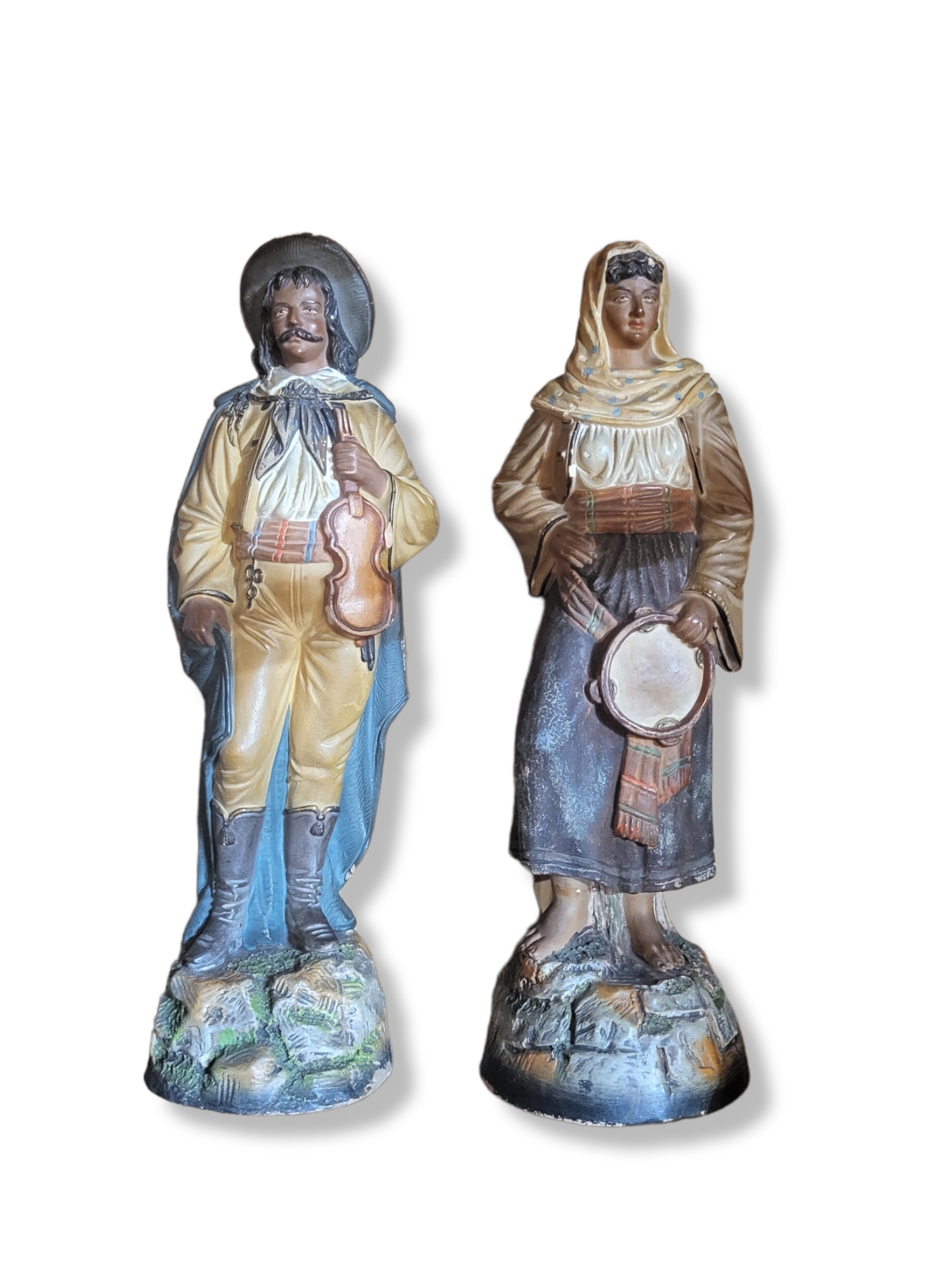 A PAIR OF 19TH CENTURY CONTINENTAL TERRACOTTA FIGURES MODELLED AS GYPSY MUSICIANS In period