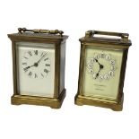 TWO EARLY 20TH CENTURY GILT BRASS CARRIAGE CLOCKS Having a single carry handle, four bevelled