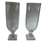 A PAIR OF CUT GLASS HURRICANE LANTERNS. (h 44cm x diameter 12cm)