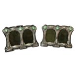 A PAIR OF ART NOUVEAU STYLE SILVER AND ENAMEL PICTURE FRAMES. (h 8cm x w 11.4cm)