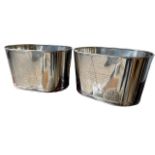 A LARGE PAIR OF OVAL SILVER PLATED CHAMPAGNE COOLERS. (h 26cm x d 28cm x w 43.5cm)