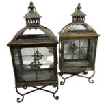 A PAIR OF DECORATIVE ORIENTAL DESIGN BRONZED LANTERNS FORMED AS PAGODAS. (h 57cm x d 17cm x w 26cm)