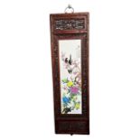 A LARGE CHINESE CARVED AND PIERCED WOOD WALL HANGING With porcelain panel painted with birds and