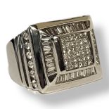 AN 18CT WHITE GOLD AND DIAMOND CLUSTER GENT’S SIGNET RING Having an arrangement of pavé cut stones