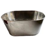 A LARGE OVAL SILVER PLATED CHAMPAGNE COOLER. (h 30cm x d 38cm x w 63.5cm)