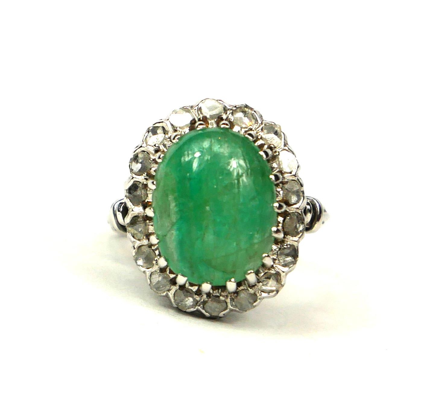 WHITE METAL, LARGE OVAL CABOCHON EMERALD AND ROSE CUT DIAMONDS RING. Emerald 4.00ct approx. Diamonds