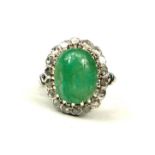 WHITE METAL, LARGE OVAL CABOCHON EMERALD AND ROSE CUT DIAMONDS RING. Emerald 4.00ct approx. Diamonds