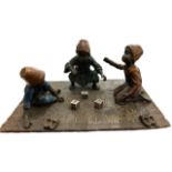 BRONZE GROUP, THREE ARAB BOYS PLAYING DICE ON A CARPET. (h 7cm x d 14cm x w 20cm)