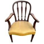 A GEORGE III HEPPLEWHITE CARVED MAHOGANY OPEN ARMCHAIR The shaped back and arms above a serpentine