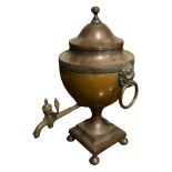 A 19TH CENTURY REGENCY COPPER TABLE SAMOVAR Having lion head handles, mounted to a stepped square