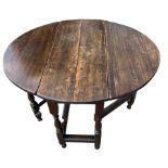 A SMALL 17TH CENTURY WILLIAM AND MARY OAK GATE LEG TABLE Supported on eight turned baluster