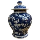 A LATE 19TH CENTURY CHINESE BLUE AND WHITE LIDDED BALUSTER VASE Decorated with prunus blossom,