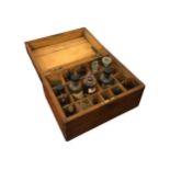 A COLLECTION OF APOTHECARY GLASSES AND VIALS Housed in a wooden case. (h 15.5cm x w 28.5cm x depth