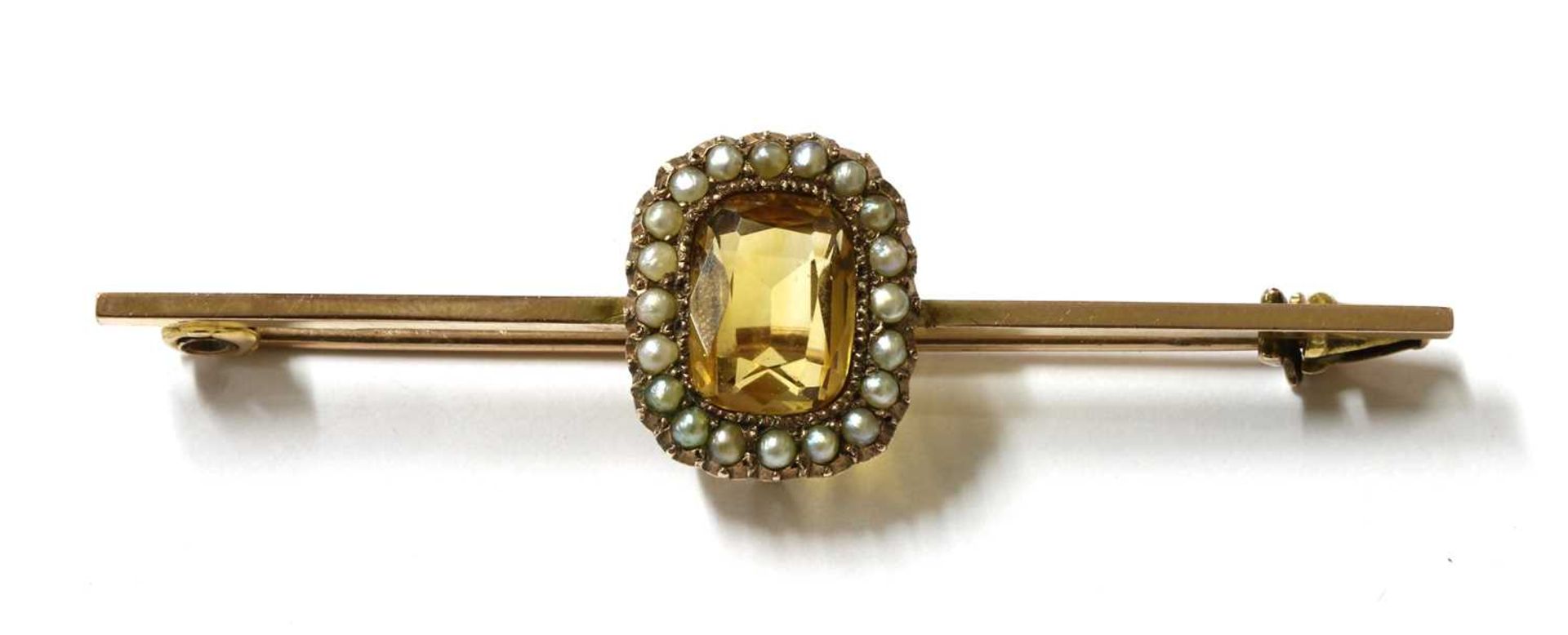 A gold citrine and split pearl brooch,