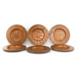 A set of six Arts and Crafts copper plates,
