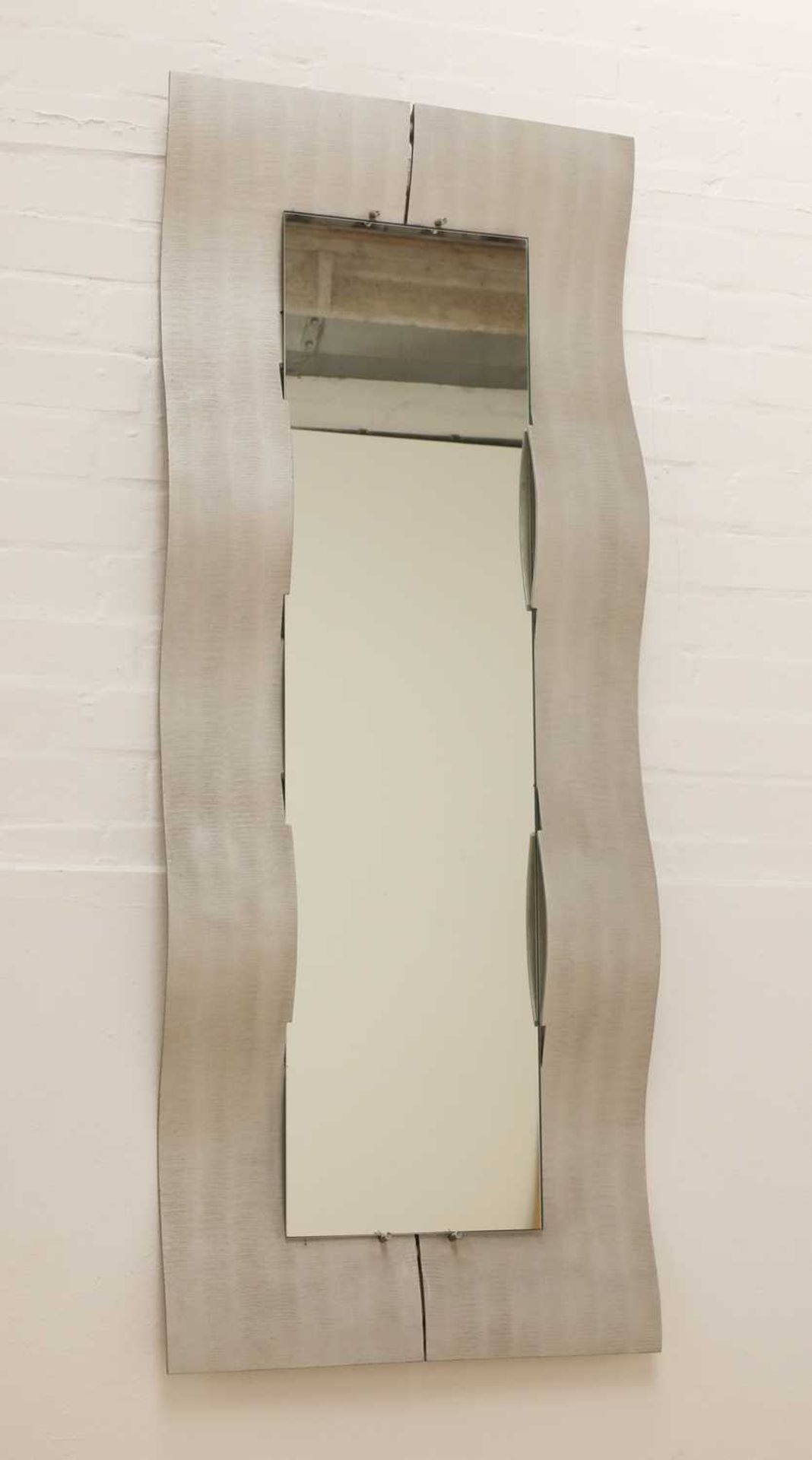 An Italian textured 'Wave' aluminium mirror,