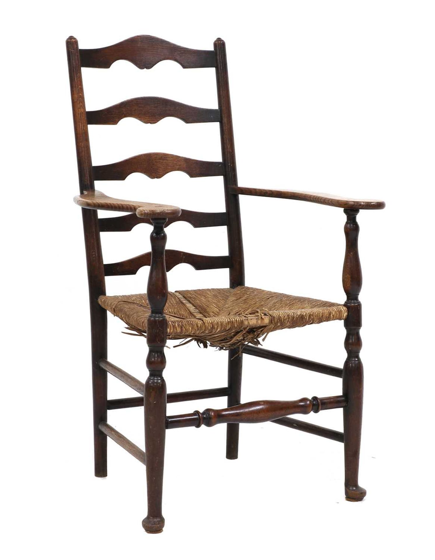 A Lutyens-style oak ladderback armchair,