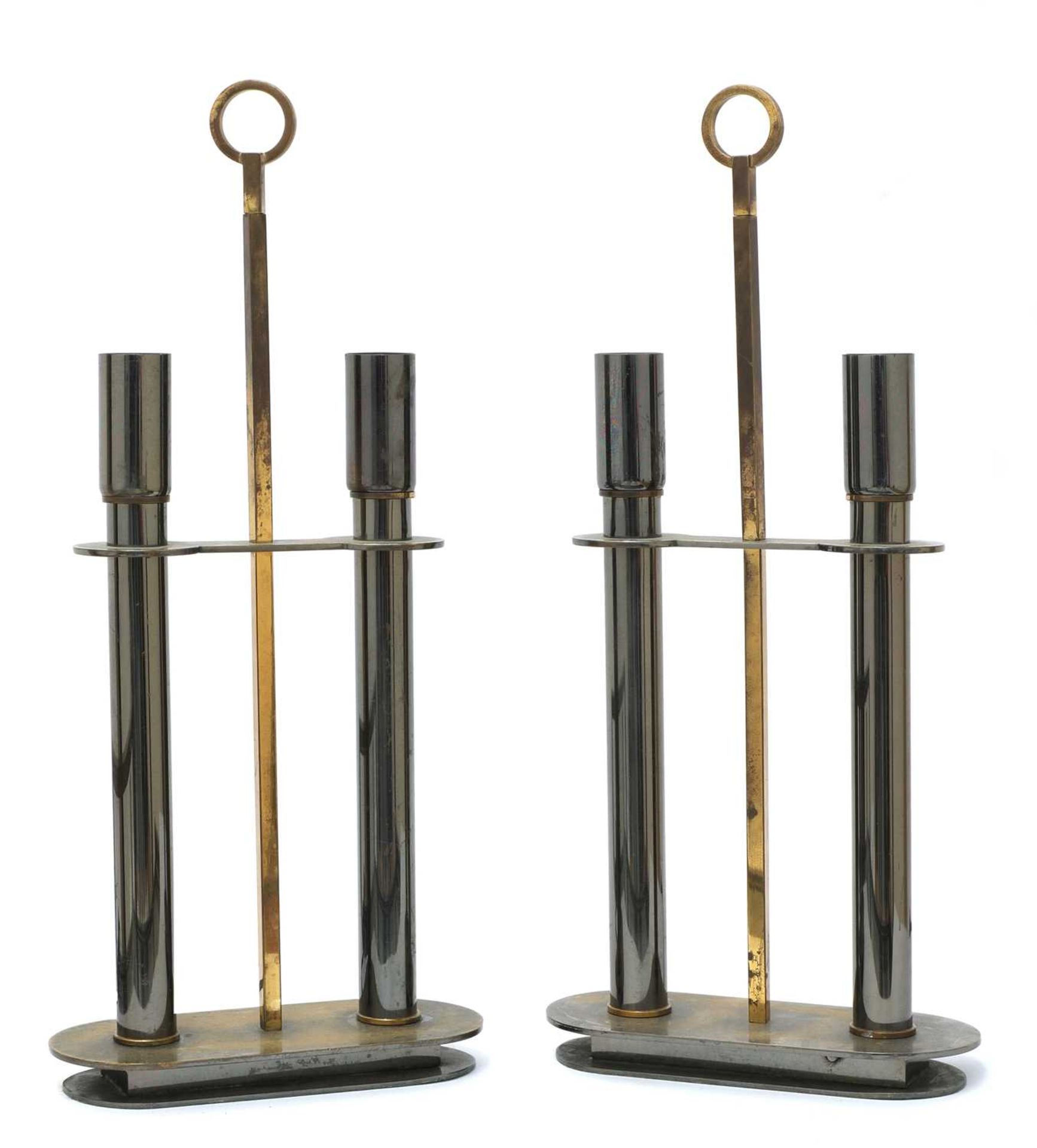 A pair of French metal and brass two-light table lamps,