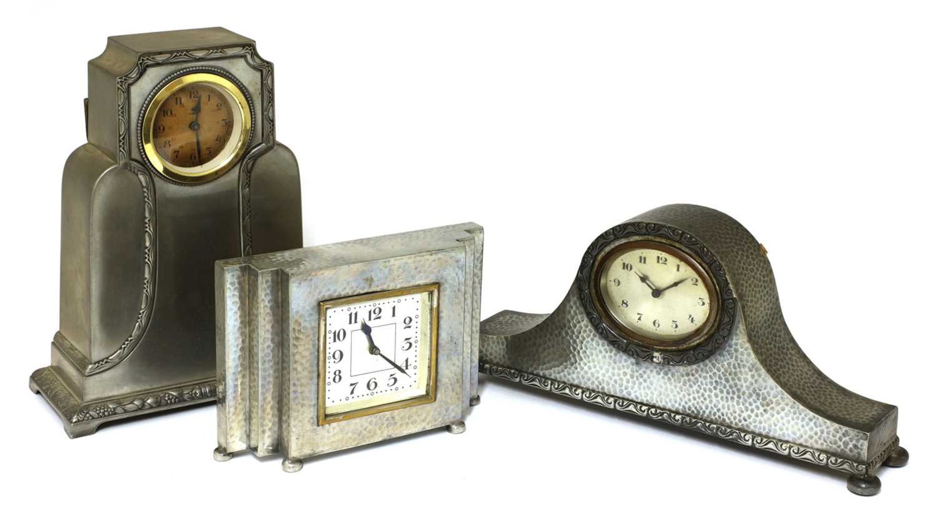 Three Art Deco pewter mantel clocks,