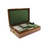 A cased set of stainless steel knives by Mackay & Chisholm,