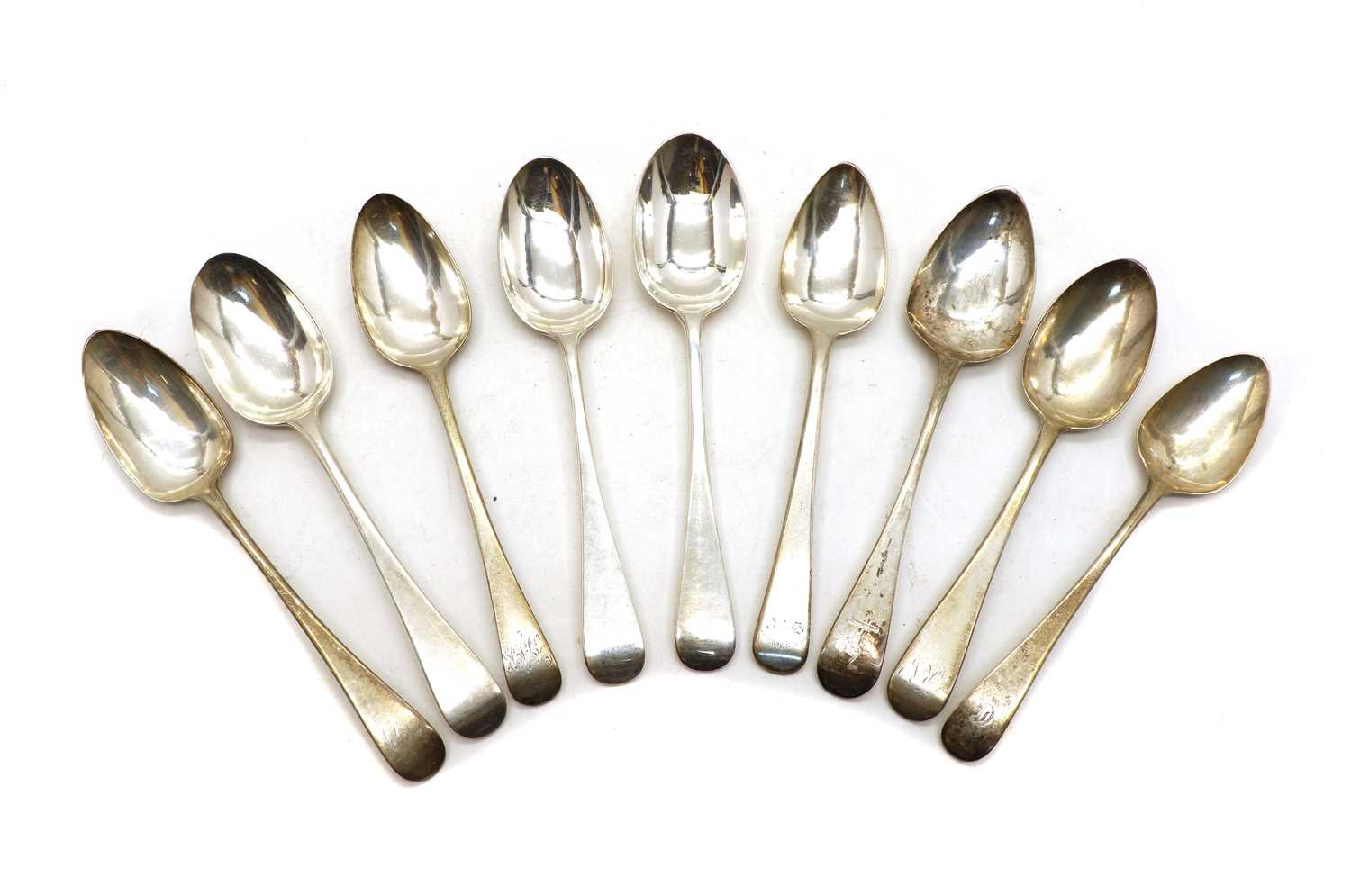 A collection of five George III Old English pattern silver dessert spoons,